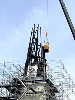 Scaffold built to deconstruct and dispose burnt steeple framing after fire.